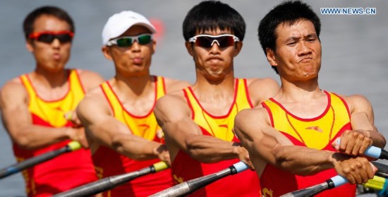 Wang Tiexin, Fan Junjie, Li Hui and Yu Chenggang (R to L) of China compete during the lightweight men's quadruple sculls final of rowing at the 17th Asian Games in Chungju, South Korea, Sept. 25, 2014. China won the gold medal.