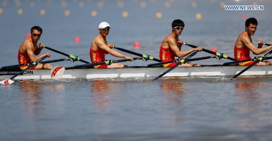 Wang Tiexin, Fan Junjie, Li Hui and Yu Chenggang (R to L) of China compete during the lightweight men's quadruple sculls final of rowing at the 17th Asian Games in Chungju, South Korea, Sept. 25, 2014. China won the gold medal.