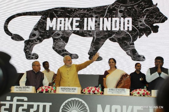 Indian Prime Minister Narendra Modi (3nd L) unveils the logo of 'Make in India' initiative prior to his scheduled departure to the United States in New Delhi, India, Sept. 25, 2014. 