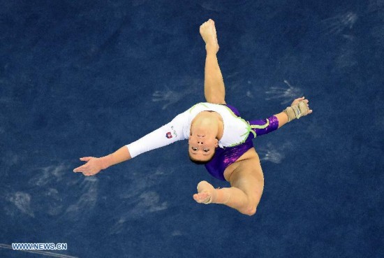 Slovakia's gymnast Barbora Mokosova performs in the floor exercise during the women's qualifying round of the 45th Gymnastics World Championships in Nanning, capital of south China's Guangxi Zhuang Autonomous Region, Oct. 5, 2014.