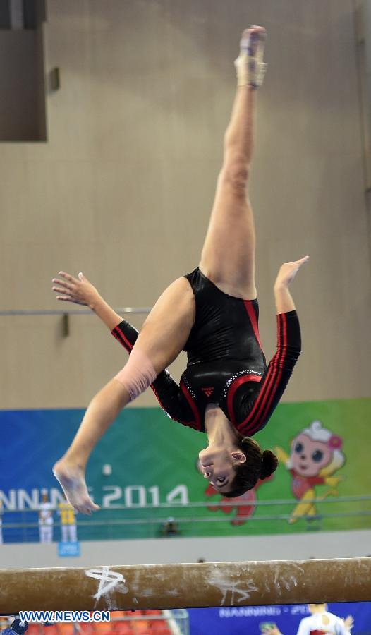 Egyptian gymnast Miriam Fouad Elhajj performs on the beam during the women's qualifying round of the 45th Gymnastics World Championships in Nanning, capital of south China's Guangxi Zhuang Autonomous Region, Oct. 5, 2014.