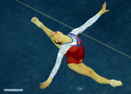 Dutch gymnast Lieke Wevers performs in the floor exercise during the women's qualifying round of the 45th Gymnastics World Championships in Nanning, capital of south China's Guangxi Zhuang Autonomous Region, Oct. 5, 2014. 