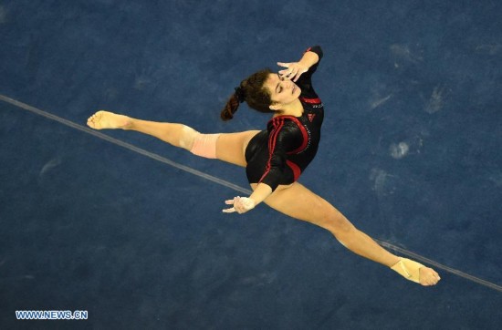 Egyptian gymnast Miriam Fouad Elhajj performs in the floor exercise during the women's qualifying round of the 45th Gymnastics World Championships in Nanning, capital of south China's Guangxi Zhuang Autonomous Region, Oct. 5, 2014. 