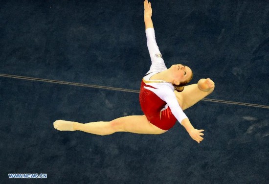 Belgian gymnast Gaelle Mys performs in the floor exercise during the women's qualifying round of the 45th Gymnastics World Championships in Nanning, capital of south China's Guangxi Zhuang Autonomous Region, Oct. 5, 2014. 