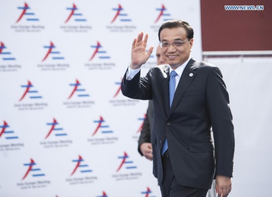 Chinese Premier Li Keqiang arrives for the opening of the tenth Asia-Europe Meeting (ASEM) in Milan, Italy, Oct. 16, 2014.