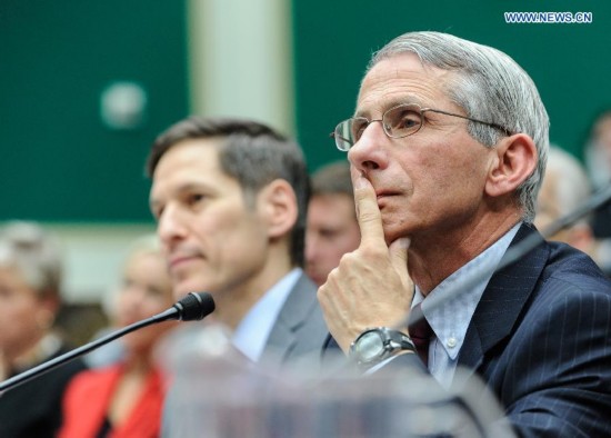 Anthony Fauci(R), director of the National Institute of Allergy and Infectious Diseases, part of the National Institutes of Health (NIH) testifies during a hearing on Examining the U.S. Public Health Response to the Ebola Outbreak before the Oversight and Investigations Subcommittee at Capitol Hill in Washington D.C., capital of the United States, Oct. 16, 2014. A hospital in Texas where an Ebola patient died and two nurses were infected apologized Thursday for mishandling the deadly disease, as the National Institutes of Health (NIH) prepared to treat the first nurse who contracted the virus while caring for the deceased.