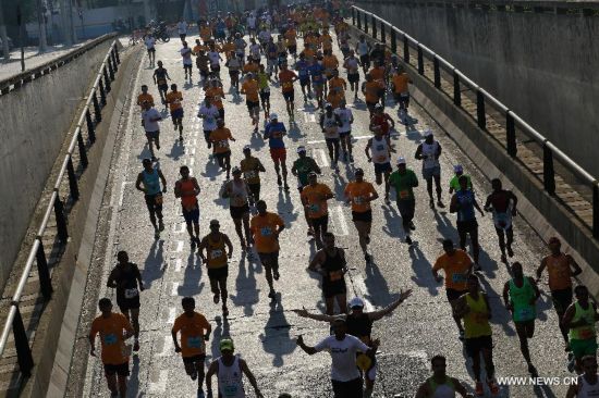 Runners take part in the 20th International Marathon of Sao Paulo, in Sao Paulo, Brazil, on Oct. 19, 2014.