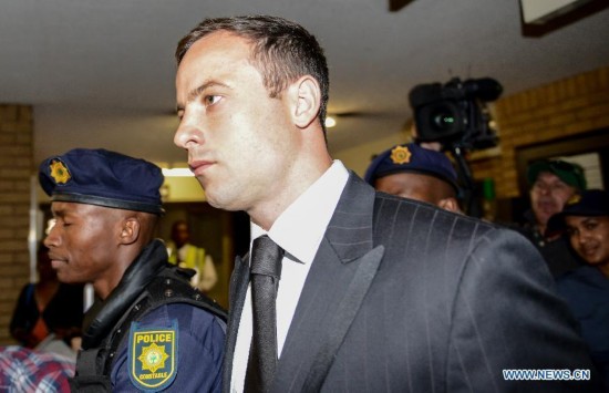 Oscar Pistorius (C) arrives at the North Gauteng High Court in Pretoria, South Africa, on Oct. 21, 2014.