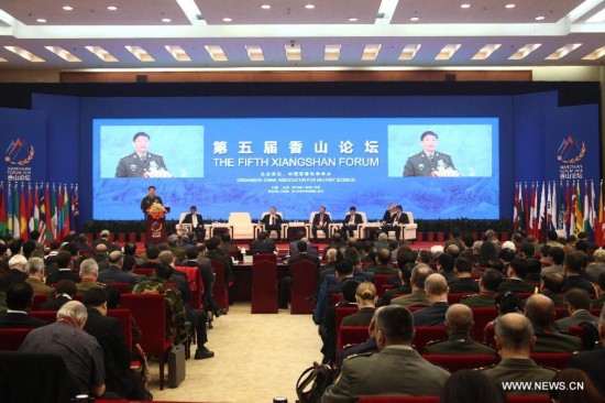 Photo taken on Nov. 21, 2014 shows the scene of the plenary meeting of the 5th Xiangshan Forum in Beijing, capital of China.