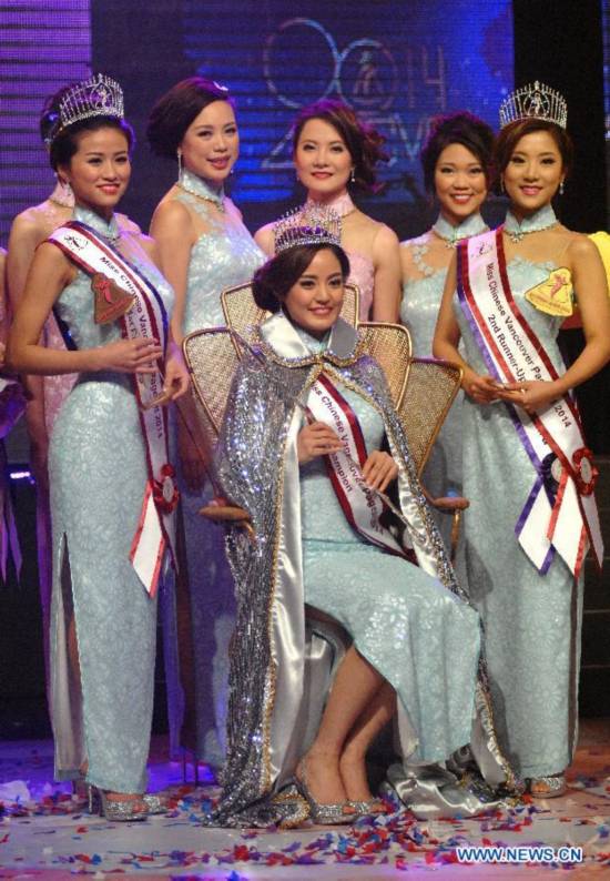 Erica Zhuhai Chen (C) poses with the 1st and 2nd runners-up after winning Miss Chinese Vancouver 2014 in Vancouver, Canada, Dec.10, 2014. Erica Zhuhai Chen will be competing in the upcoming Miss Chinese International Pageant in Hong Kong in January 2015.