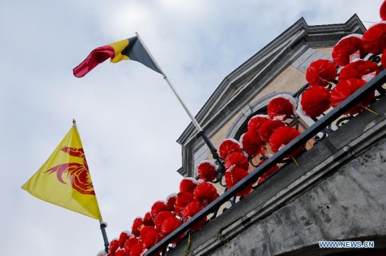 A building is decorated with Chinese lanterns during the Art Biennale in Theux in eastern Belgium on Jan. 24, 2015. 