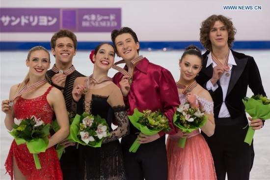 Gold medalists Lorraine McNamara (3rd L) and Quinn Carpenter (3rd R) of USA, silver medalists Rachel Parsons (L) and Michael Parsons (2nd L) of USA and bronze medalists Alla Loboda (2nd R) and Pavel Drozd of Russia celebrate their victory during the awarding ceremony of Ice Dance competition at the ISU World Junior Figure Skating Championships in Debrecen, Hungary, March 19, 2016.