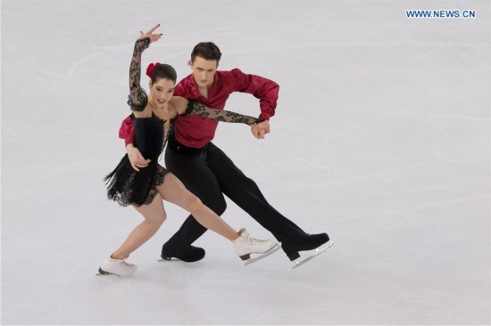 Gold medalists Lorraine McNamara (L) and Quinn Carpenter of the United States compete during the Ice Dance competition at the ISU World Junior Figure Skating Championships in Debrecen, Hungary, March 19, 2016.