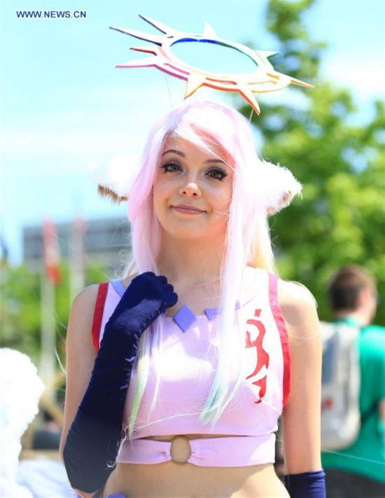 A cosplayer poses for photos during the 2016 Anime North event at the Toronto Congress Centre in Toronto, Canada, May 28, 2016. 