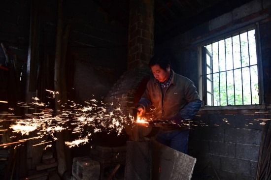 Craftsman makes scissors in traditional way