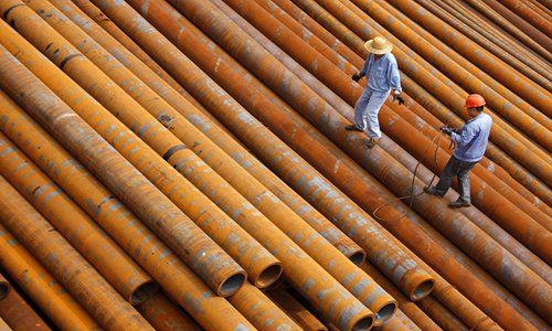 Workers prepare seamless steel tubes for export to the US at a factory in Huaibei, East China's Anhui Province. File Photo: CFP