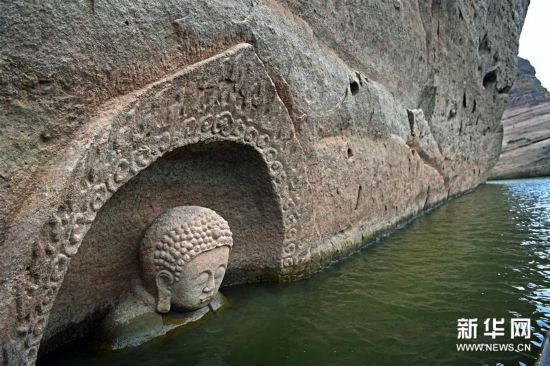 江西南城一水库发现摩崖造像 佛头遗迹浮出水