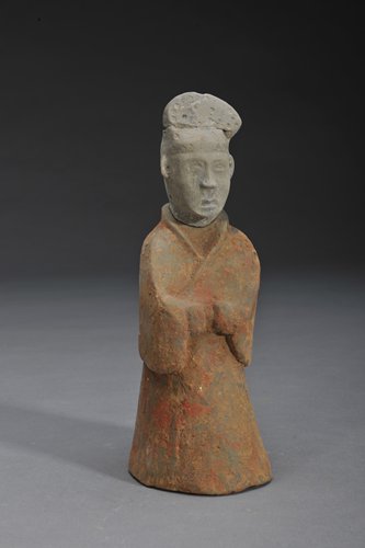 The site of the ancient city of Tanjialing, Hubei ProvinceTop: A jade statue (left) unearthed at the Neolithic Shijiahe Culture site in Hubei Province and a pottery statuette excavated from the Xizhucun Tomb in Henan Province Photos: Courtesy of the CASS Institute of Archeology 