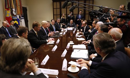 President Donald Trump meets with business leaders on Monday in the Roosevelt Room of the White House in Washington. Photo: AP