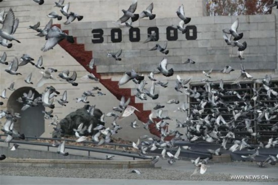 Photo taken on Dec. 13, 2017 shows pigeons flying during the state memorial ceremony for China's National Memorial Day for Nanjing Massacre Victims at the memorial hall for the massacre victims in Nanjing, east China's Jiangsu Province. [Photo: Xinhua]