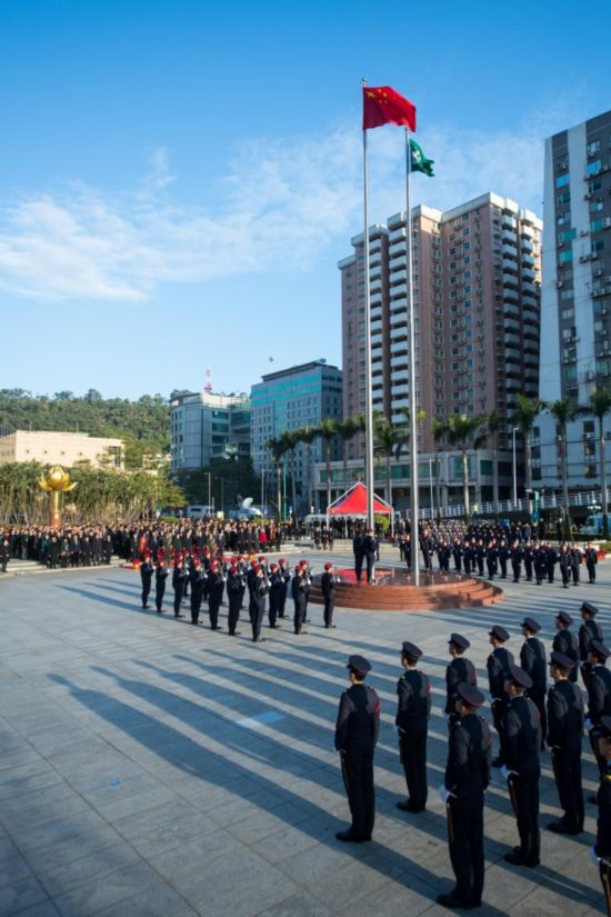 The government of Macao Special Administrative Region of the People's Republic of China holds a grand flag raising ceremony on Wednesday to celebrate the 18th anniversary of its return to the motherland at Golden Lotus Square. [Photo: China Plus/ Liu Libin]