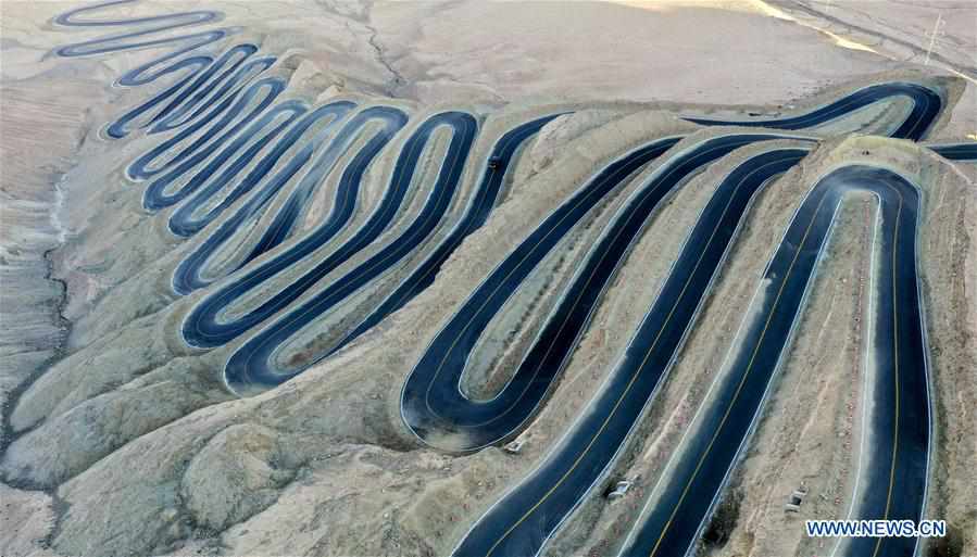 Aerial photo taken on Oct. 20, 2019 shows a view of a mountain road in Tajik Autonomous County of Taxkorgan, northwest China's Xinjiang Uygur Autonomous Region. The road, constructed on the Pamir Plateau at an altitude of more than 4,200 meters with a 1,000-meter drop in height, is hailed as the 