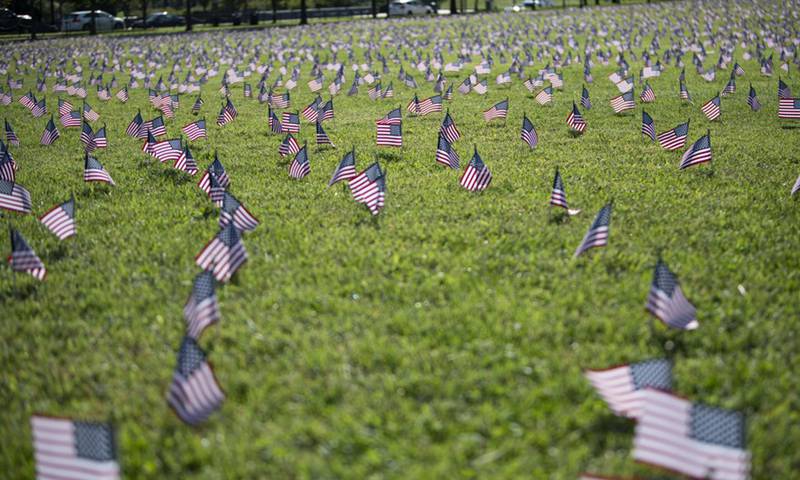 US national flags representing the 200,000 lives lost to COVID-19 in the United States are placed on the National Mall in Washington, D.C., the United States, on Sep 22, 2020. US COVID-19 deaths surpassed 200,000 on Tuesday, according to the Center for Systems Science and Engineering (CSSE) at Johns Hopkins University.Photo:Xinhua