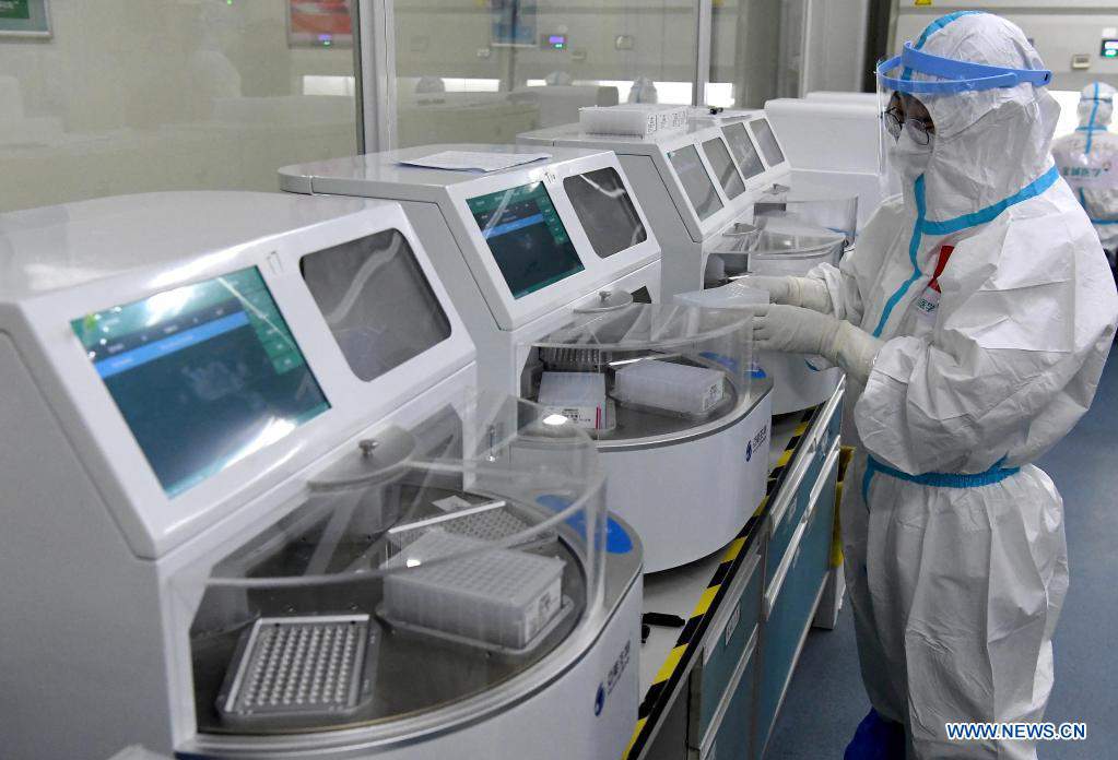 Medical workers work round-the-clock in lab for COVID-19 nucleic acid testing in Zhengzhou, C China