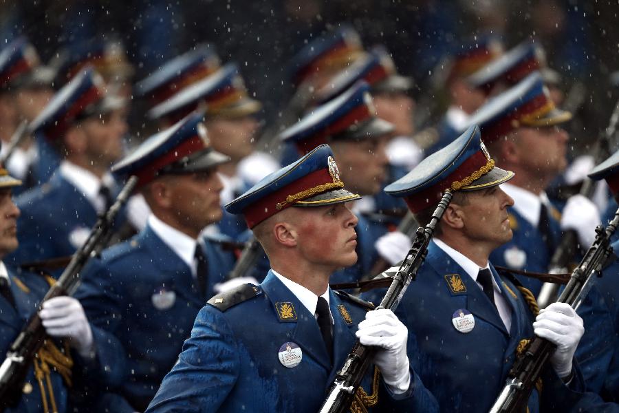 Serbian troops march during a military parade to mark 70 years since the city's liberation by the Red Army in Belgrade October 16, 2014. 