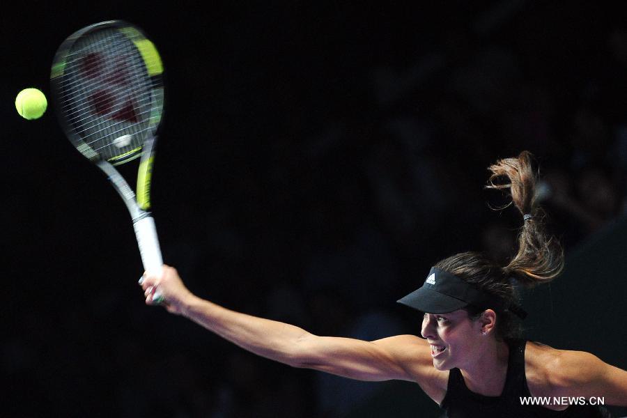 Serbia's Ana Ivanovic serves during the round robin match of the WTA Finals against Serena Williams of the United States at the Singapore Indoor Stadium, Oct. 20, 2014. Serena Williams won 2 to 0. (Xinhua/Then Chih Wey) 