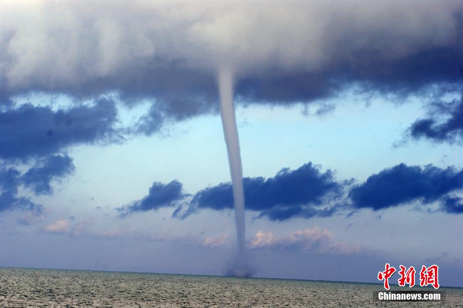 A waterspout is seen on the Qinghai Lake, northwestern China's Gansu Province, October 20, 2014.