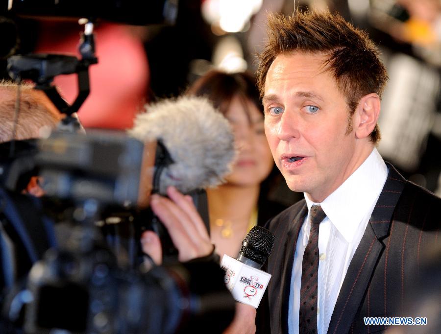 U.S. director and jury member of competition James Gunn answers to interviews upon his arrival at the red carpet ceremony of the 27th Tokyo International Film Festival in Tokyo, Japan, Oct. 23, 2014.