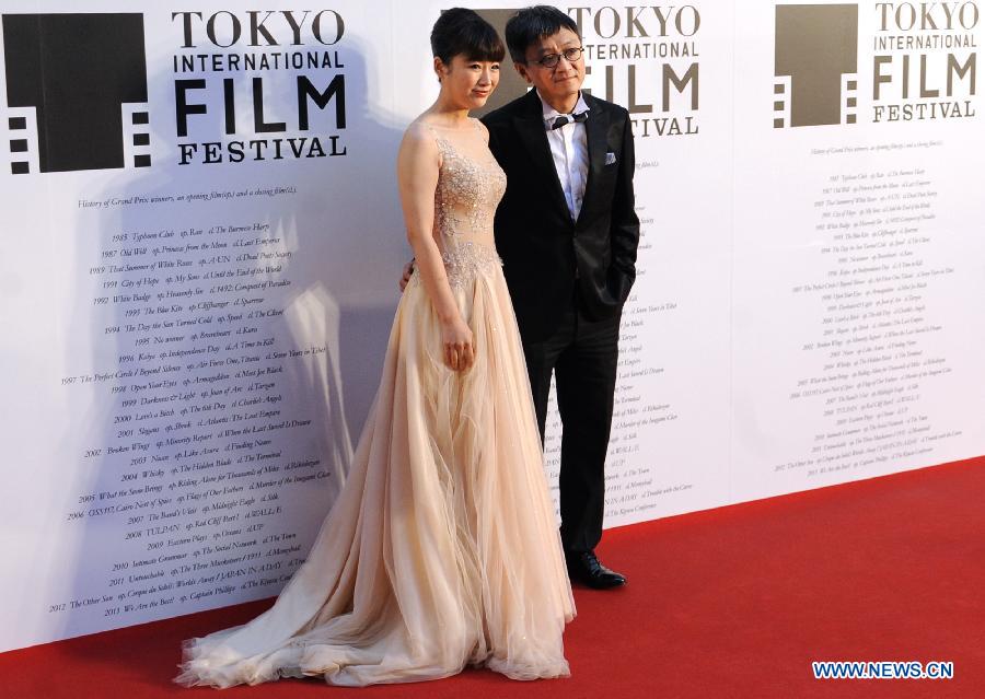 Chinese director Yu Baimei (R) and actress Dai Lele from 'The Breakup Guru' pose for photos at the red carpet ceremony of the 27th Tokyo International Film Festival in Tokyo, Japan, Oct. 23, 2014.