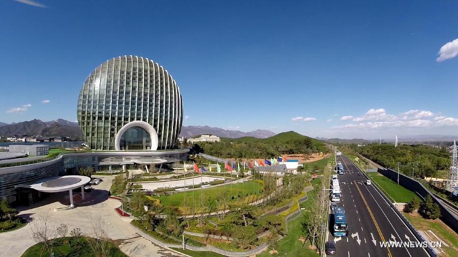 Photo taken on Oct. 15, 2014 shows the Sunrise East Kempinski Hotel near the Yanqi Lake in the Huairou District of Beijing, capital of China. The 2014 APEC economic leaders' meeting will be held at Beijing's outskirt Yanqi Lake in November. 