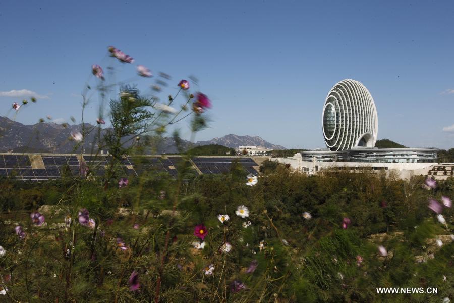 Photo taken on Oct. 15, 2014 shows the Sunrise East Kempinski Hotel near the Yanqi Lake in the Huairou District of Beijing, capital of China. The 2014 APEC economic leaders' meeting will be held at Beijing's outskirt Yanqi Lake in November. 