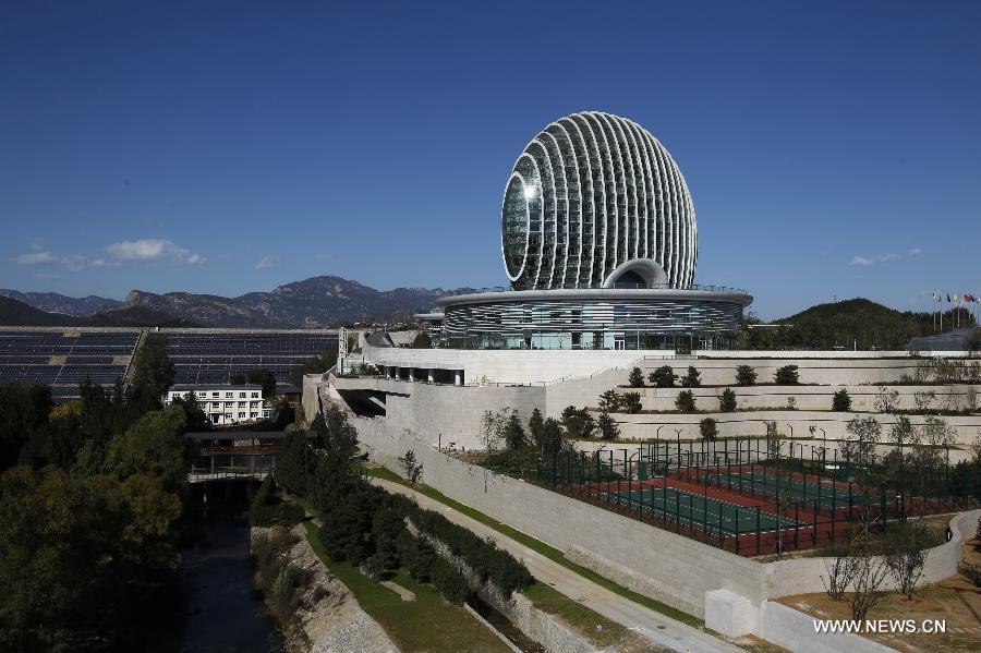 Photo taken on Oct. 15, 2014 shows the Sunrise East Kempinski Hotel near the Yanqi Lake in the Huairou District of Beijing, capital of China. The 2014 APEC economic leaders' meeting will be held at Beijing's outskirt Yanqi Lake in November.