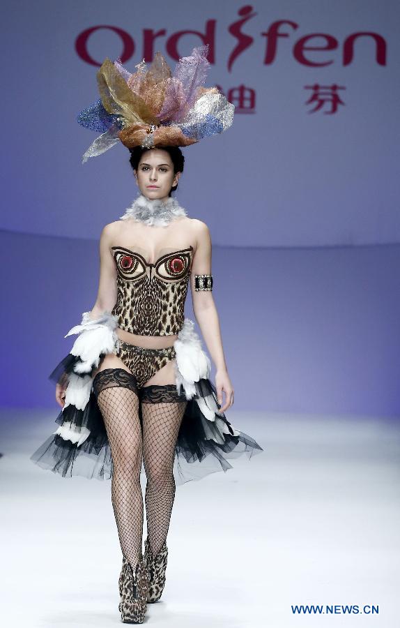 A model presents a creation at the Ordifen underwear design contest during China Fashion Week in Beijing, capital of China, Oct. 29, 2014.