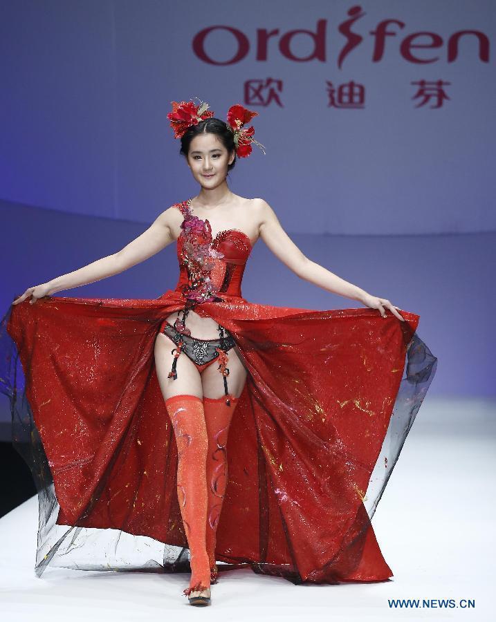 A model presents a creation at the Ordifen underwear design contest during China Fashion Week in Beijing, capital of China, Oct. 29, 2014.