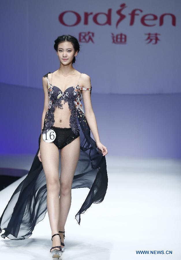 A model presents a creation at the Ordifen underwear design contest during China Fashion Week in Beijing, capital of China, Oct. 29, 2014. 