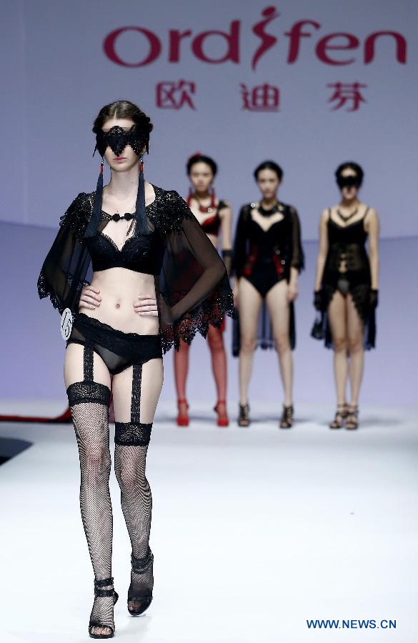 A model presents a creation at the Ordifen underwear design contest during China Fashion Week in Beijing, capital of China, Oct. 29, 2014.