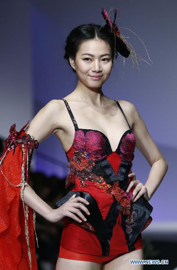 A model presents a creation at the Ordifen underwear design contest during China Fashion Week in Beijing, capital of China, Oct. 29, 2014.
