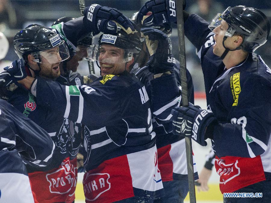 Players of Medvescak Zagreb celebrate scoring against Metallurg Novokuznetsk during a match of the Kontinental Hockey League (KHL) in Zagreb, capital of Croatia, Oct. 29, 2014. 