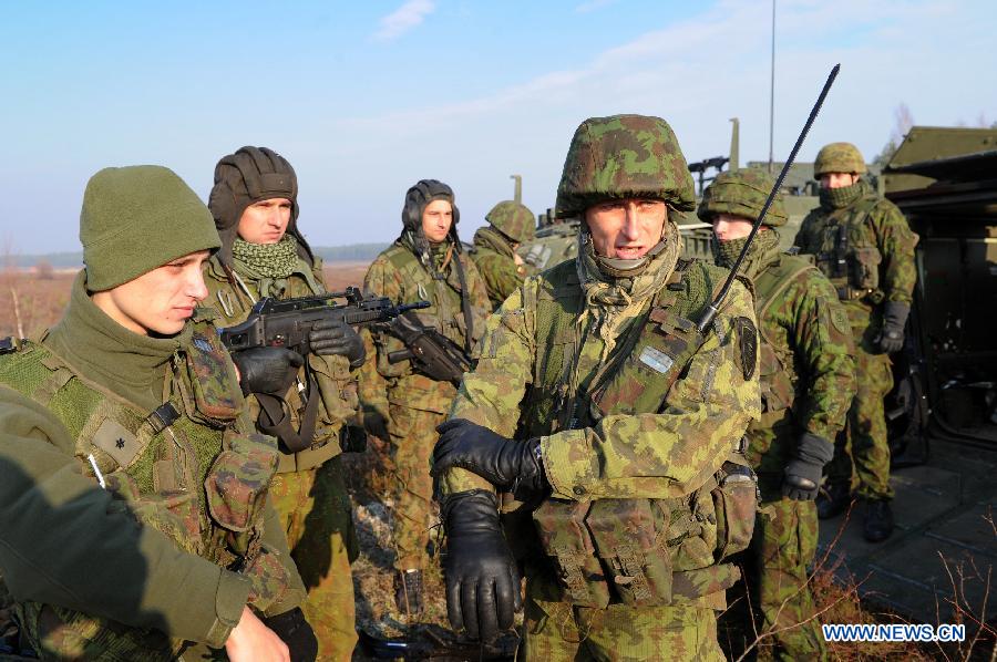 Lithuanian soldiers take part in the military exercise in Pabrade, Lithuania on Oct. 30, 2014. Lithuanian and US soldiers participated a infantry fighting vehicles live-fire exercise here on Thursday. 