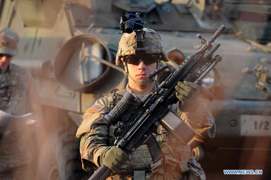 US soldiers take part in the military exercise in Pabrade, Lithuania on Oct. 30, 2014. Lithuanian and US soldiers participated a infantry fighting vehicles live-fire exercise here on Thursday.