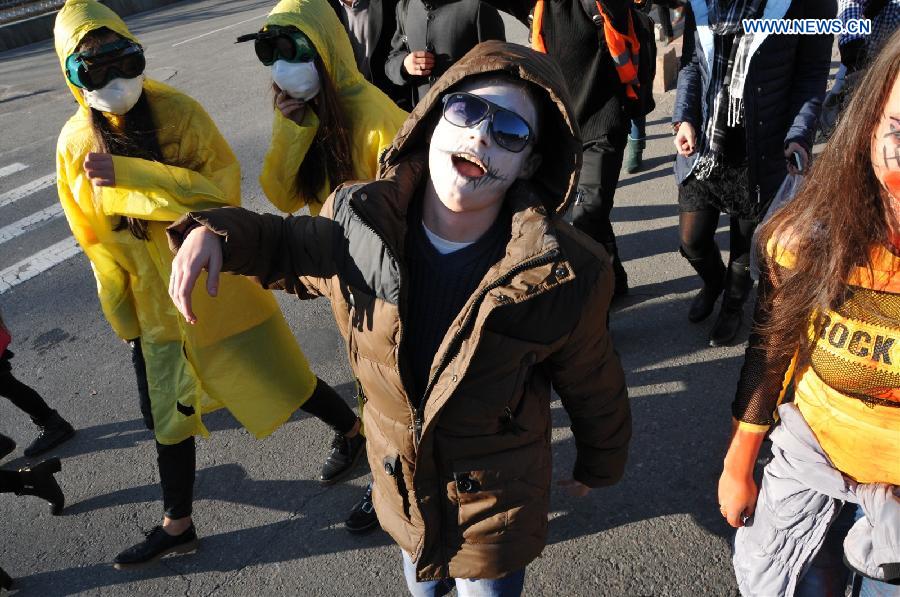 Young people with zombie makeups attend a rally to celebrate Halloween in the downtown area of Bishkek, Kyrgyzstan, on Oct. 31, 2014.