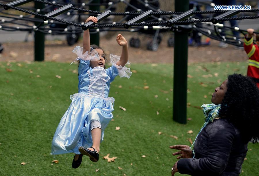 Children dressed in Halloween costume take part in Halloween Parade in New York, the United States, on Oct. 31, 2014. The annual Children's Halloween Parade is held here to celebrate Halloween on Friday. 