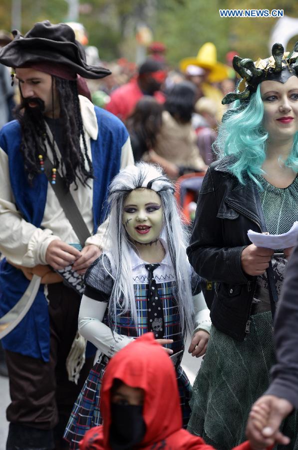 Children dressed in Halloween costume take part in Halloween Parade in New York, the United States, on Oct. 31, 2014. The annual Children's Halloween Parade is held here to celebrate Halloween on Friday. 