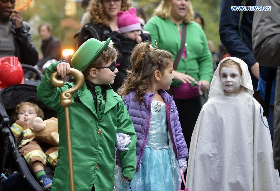 Children dressed in Halloween costume take part in Halloween Parade in New York, the United States, on Oct. 31, 2014. The annual Children's Halloween Parade is held here to celebrate Halloween on Friday. 