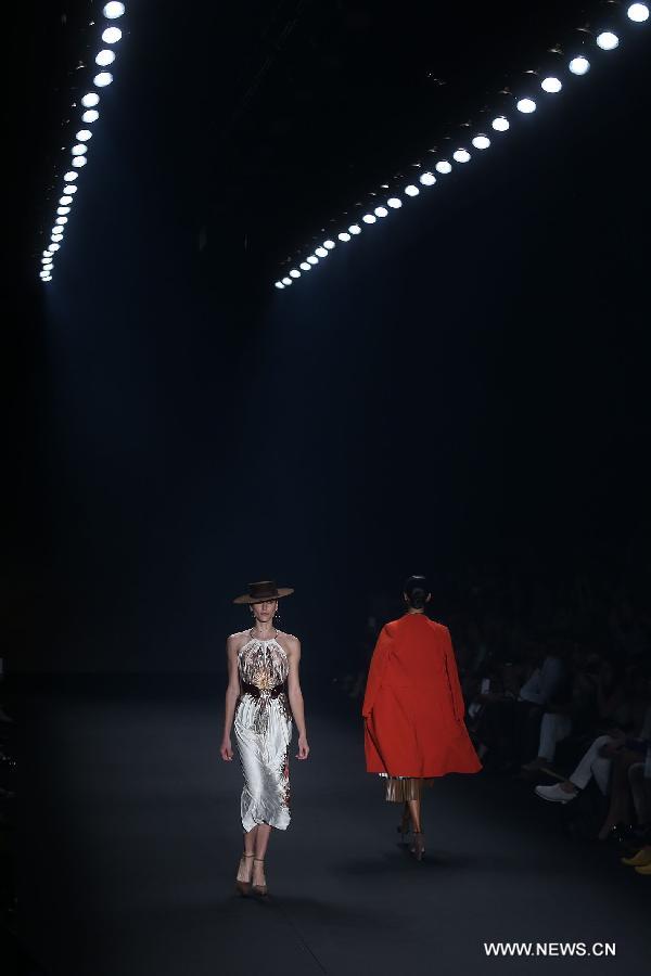 Models present creations of the winter collection Animale 2015 during the 38th Sao Paulo Fashion Week (SPFW), in Sao Paulo, Brazil, on Nov. 3, 2014. 