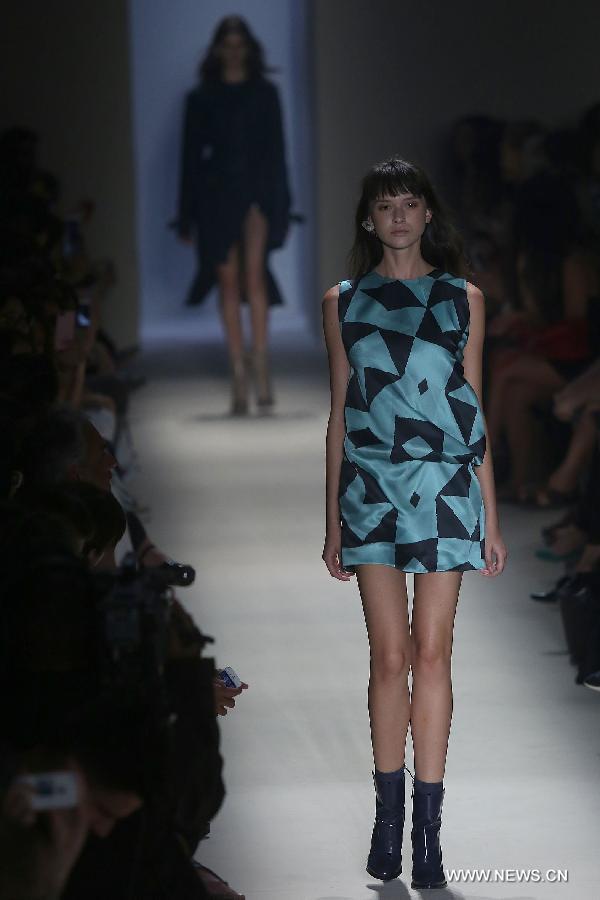 A model presents a creation of the winter collection Animale 2015 during the 38th Sao Paulo Fashion Week (SPFW), in Sao Paulo, Brazil, on Nov. 3, 2014. 
